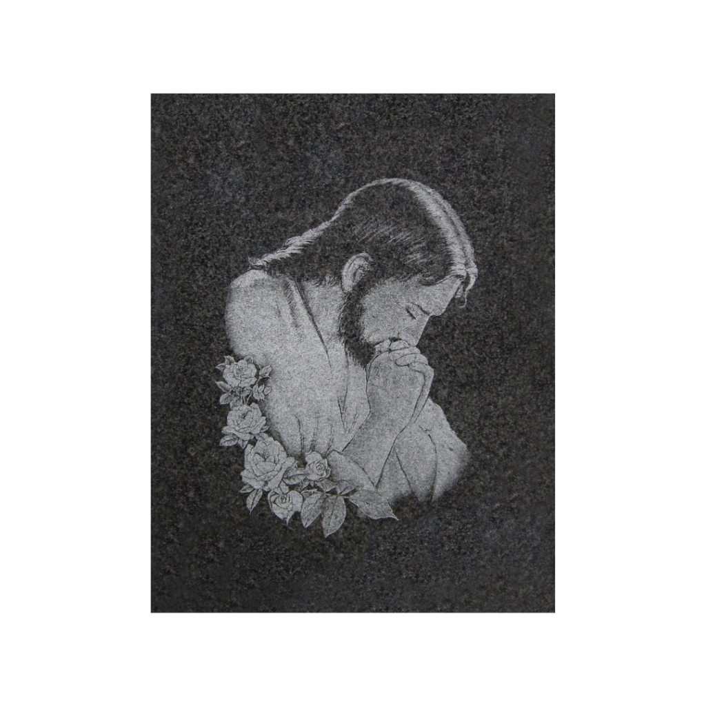 Grawer Jezusa w modlitwie na pomniku